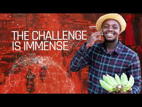 A smiling person, wearing a straw hat and a checked shirt, is holding a bunch of bananas. The background is a red-coloured collage of technological and graphic elements, highlighting "Africa's Digital Economy". The text on the image reads "The challenge is immense" in large white letters. | Morabeza Marketing